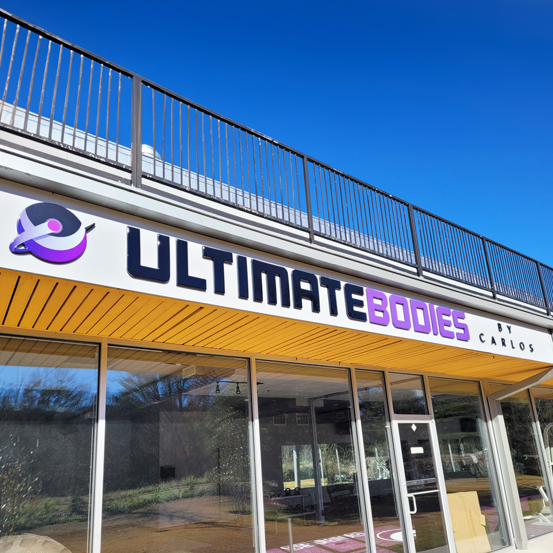 Raised black and purple formed-plastic storefront letters