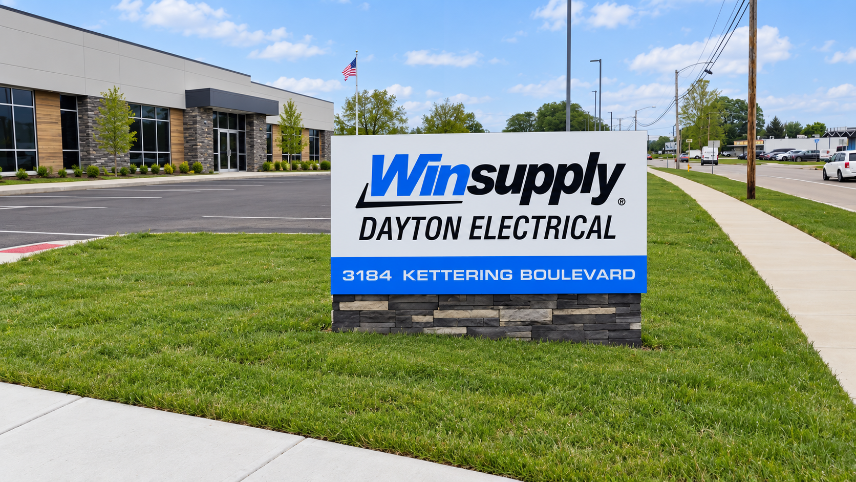 Winsupply ground-mounted cabinet sign on its stone base